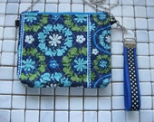 blue and green quilted crossbody bag with wristlet strap