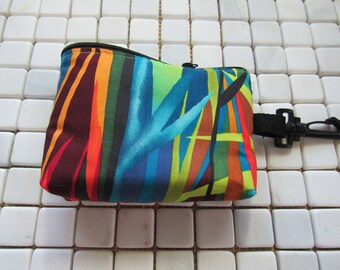 padded zipper pouch in rainbow grass print with large clasp