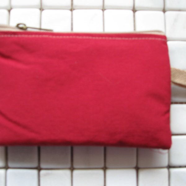 padded zipper pouch in red outdoor nylon