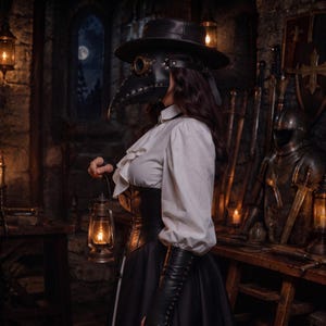 May include: A black plague doctor mask with brass-rimmed eye lenses and a wide-brimmed hat, paired with a white ruffled blouse, a black corset, and long black gloves. A metal lantern with a glowing light is held in one hand, completing the ensemble.