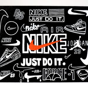 May include: A black and white graphic art print featuring various Nike logos, slogans, and shoe designs. The words "NIKE", "JUST DO IT", "AIR", and "JORDAN" are prominently displayed. An orange swoosh logo is also visible.