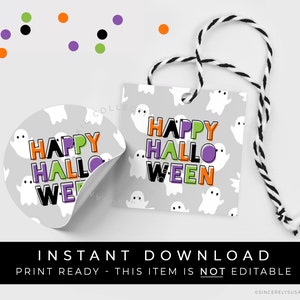 May include: Printable Halloween gift tags with a ghost pattern and the text "Happy Hallo Ween" in colorful letters. The tags are attached to a black and white twine.