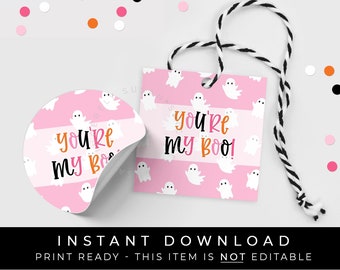 May include: Pink and white ghost-themed gift tags with the text "you're my boo!" printed on them. The tags are designed with a white string for hanging.