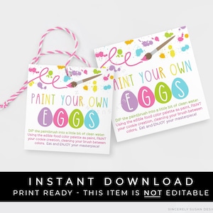 May include: Two pink and yellow printable tags with the text "Paint Your Own Eggs" and colorful paint splatters. The tags are for an Easter egg decorating activity.