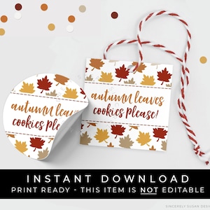 May include: Printable autumn leaves cookie tags with a white background and a red, orange, and yellow leaf pattern. The text on the tag reads "autumn leaves cookies please!"