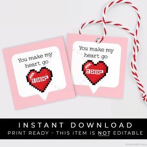 May include: Two pink printable gift tags with white borders and a red pixelated heart with the text "BEEP" inside. The text on the tags reads "You make my heart go BEEP".