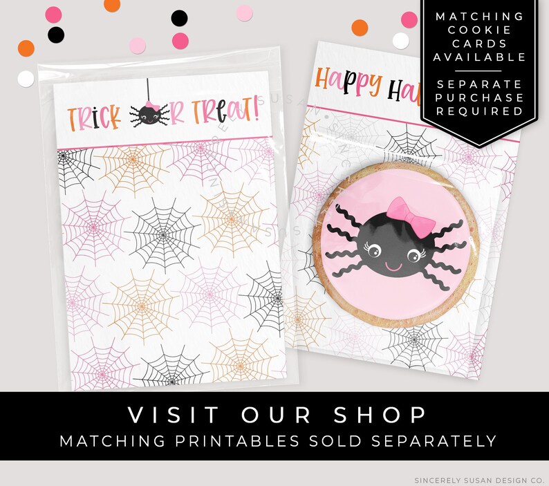 May include: A clear plastic bag with a pink and black spider cookie inside. The bag has a white label with the text "Trick or Treat!" and a spider web pattern. The bag is sitting on a white surface with a pink and orange spider web pattern.