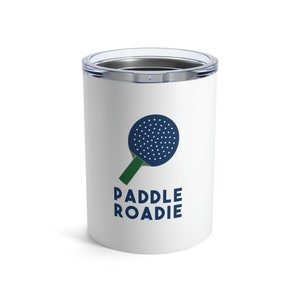 May include: White stainless steel tumbler with a blue and green paddle logo and the text "PADDLE ROADIE".