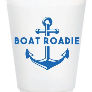 May include: White plastic cup with a blue anchor and the text "BOAT ROADIE" printed on it.