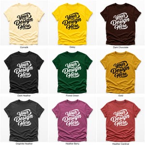 Flatlay display of Gildan 64000 t-shirt mockup bundle in over 50 colors, showcasing various blank shirts including black, red, orange, purple, yellow, green, mint, and pink, each with 'Your Design Here' placeholder text for custom design previews.