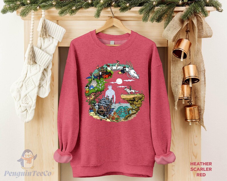 A red sweater with a colorful graphic design hangs on a wooden hanger, surrounded by Christmas stockings and ornaments.