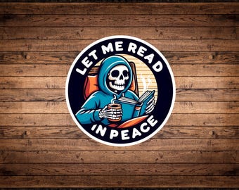 May include: A black and white sticker with a skeleton in a blue hoodie reading a book and holding a cup of coffee. The text around the skeleton reads "Let me read in peace".