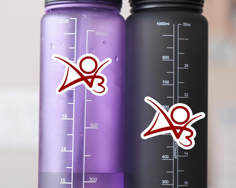 May include: Two water bottles with measurement markings in ounces and milliliters. The bottles are purple and black. Each bottle has a red and white sticker with a stylized figure.