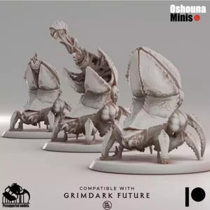 May include: Three light gray miniature scorpion-like figures. The figures have large, segmented bodies, claw-like appendages, and a raised, detailed head. The text "Oshouna Minis" is in the upper right corner. The text "Compatible with Grimdark Future" is at the bottom.