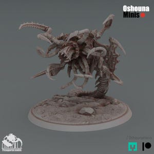 May include: A light-coloured, unpainted resin miniature figure of a multi-limbed, tentacled creature with a central maw and segmented body, standing on a circular base. The text Oshouna Minis is visible in the upper right corner of the image.