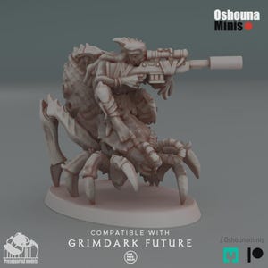 May include: A light brown miniature figure of a creature with a rider, aiming a rifle with a scope. The figure is mounted on a base. The image includes the text "COMPATIBLE WITH GRIMDARK FUTURE" and the brand name "Oshouna Minis".