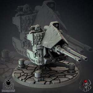 May include: A gray, pre-supported miniature war machine with a double-barreled cannon, shield, and detailed figures. The model sits on a textured base with support structures and a logo.