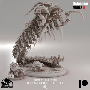 May include: An off-white miniature of a monstrous creature with a segmented body, sharp claws, and a complex head. The base features the text "COMPATIBLE WITH GRIMDARK FUTURE" and the logo for Oshouna Minis.