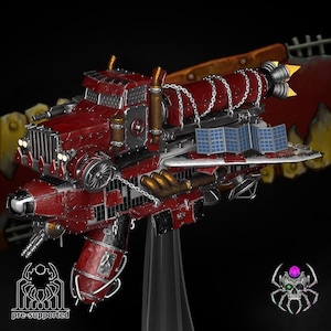May include: A detailed model of a red and silver vehicle with a futuristic design. The model features solar panels, exhaust pipes, and a propeller. The text "pre-supported" is visible on the bottom left.