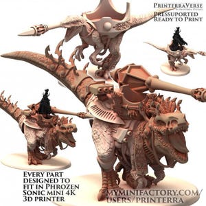 May include: A detailed 3D-printed model of a dinosaur-like creature with riders and weaponry. The model is tan and features intricate designs, including a large weapon and decorative elements. The text on the image says "PRINTERRAVERSE" and "READY TO PRINT".