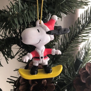 Vintage Santa Snoopy on a Snowboard Christmas Ornament PVC