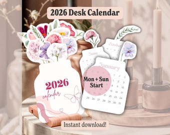 May include: A 2026 desk calendar with a floral design. The calendar features a white vase shape with the text "2026 calendar" and a butterfly illustration. Individual monthly calendars are also shown, with the text "Mon + Sun Start".