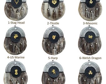 May include: Nine different sporrans, traditional Scottish accessories, are displayed. Each sporran features a silver-toned cantle, a fur body, and decorative tassels. The designs include a stag head, thistle, Masonic symbol, US Marine emblem, harp, Welsh dragon, St. Andrew, rampant lion, and shamrock.
