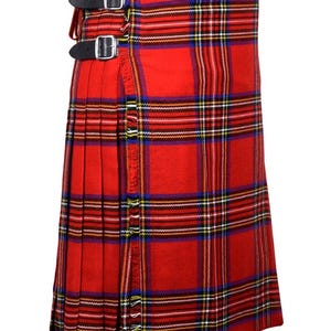 May include: A red tartan kilt with a traditional plaid pattern. The kilt features black leather straps with silver buckles and a fringed edge. The fabric is a vibrant red with blue, yellow, and white stripes.