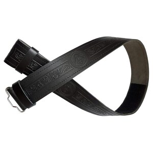 May include: Black leather belt with embossed scrollwork and Masonic symbols. The belt features a silver-colored buckle and a hook-and-loop closure. The belt is approximately 1.5 inches wide.