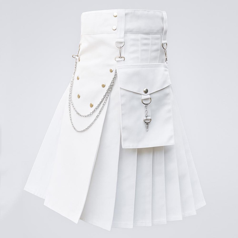 May include: A white kilt with a pleated design, featuring a pocket, metal chain, and decorative rivets. The kilt has a belt with metal hardware and a front flap. The overall design is modern and stylish.