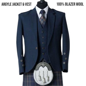 May include: A navy blue Argyle jacket and vest made of 100% blazer wool. The jacket has buttoned cuffs and a three-button vest. A patterned tie and a white shirt are visible. A traditional sporran and kilt complete the outfit.