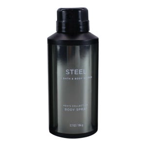 May include: A dark grey body spray bottle with a black cap. The bottle is labelled "STEEL" by Bath & Body Works, and "MEN'S COLLECTION BODY SPRAY". It contains 104 g of product. The bottle has a cylindrical shape and a metallic finish.