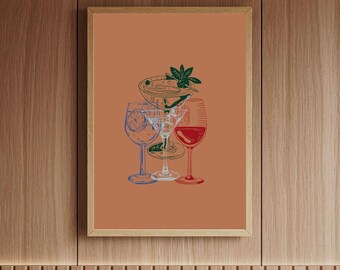 May include: A framed art print featuring a line drawing of various cocktail and wine glasses. The glasses are outlined in blue, clear, and red, with a bowl of food and garnish above. The background is a solid orange color, and the frame is a light brown.