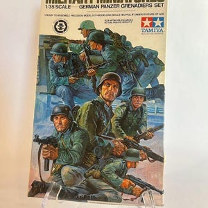 May include: A box of Tamiya 1/35 scale plastic model kit of German Panzer Grenadiers. The box art depicts a group of soldiers in World War II era German uniforms, holding rifles and other weapons.