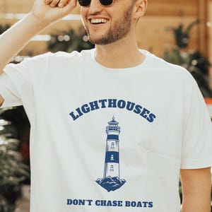 Lighthouses Don&#39;t Chase Boats Tee: Coastal Nautical Graphic T-Shirt