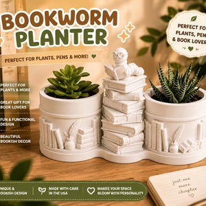 May include: A white, multi-sectioned planter featuring a stack of books in the centre topped with a small worm wearing glasses and reading a book. The sides of the planter are decorated with embossed images of books and a quill pen in an inkwell.