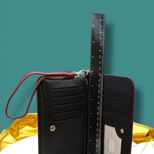 Interior view of Little Women wallet showing card slots and zip pocket with ruler to show height of approximately. 7 inches