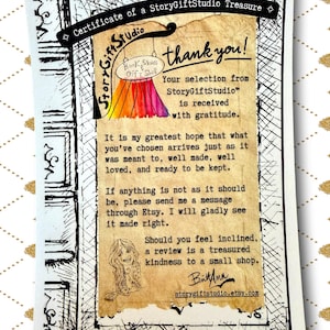 Close up of StoryGiftStudio certificate of a story gift studio treasure showing printed message of thanks and customer care information on decorative paper