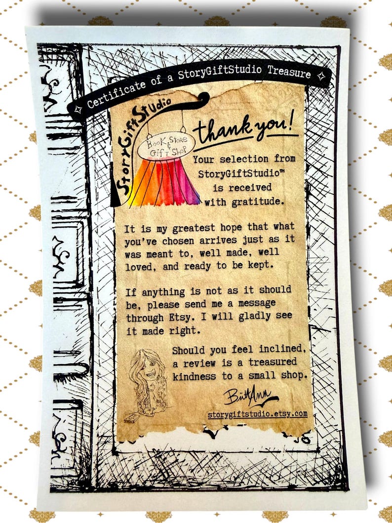 Close up of StoryGiftStudio certificate of a story gift studio treasure showing printed message of thanks and customer care information on decorative paper