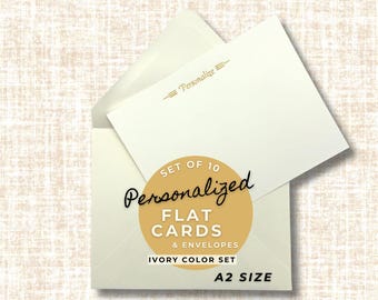 May include: Ivory-colored flat cards and envelopes set. The set includes 10 personalized cards in A2 size. The cards are displayed inside an open envelope, with the word "Personalize" printed at the top.