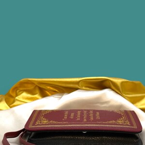 Little Women wallet styled with classic book and stationery flat lay