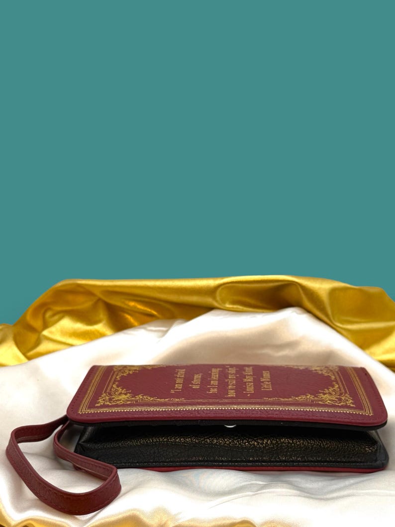 Little Women wallet styled with classic book and stationery flat lay