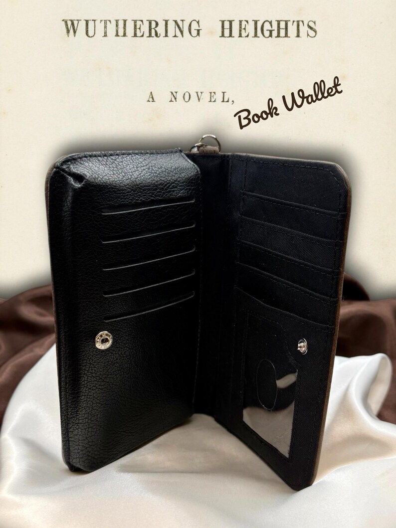 Interior of Wuthering Heights book wallet shown open, revealing card slots, ID window, and organized compartments with black fabric lining
