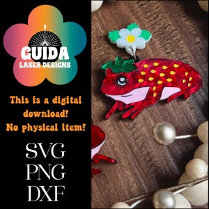 May include: Digital download of a red and green strawberry frog with a white flower on top. The image includes the text "GUIDA LASER DESIGNS", "This is a digital download!" and "No physical item!" as well as the file types "SVG", "PNG", and "DXF".