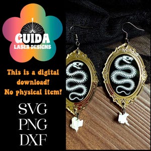 May include: A pair of ornate earrings featuring a white snake design on a black background, framed in gold. Each earring has a small, bone-shaped charm hanging below. The image also includes the text "This is a digital download! No physical item!"