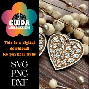 May include: Heart-shaped earrings with a leaf design. The earrings are made of wood with a white leaf pattern on a brown background. The image also includes text that says "This is a digital download! No physical item!" and the file types SVG, PNG, and DXF.