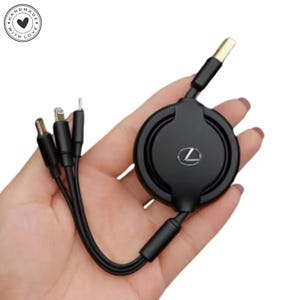 May include: A black retractable charging cable with multiple connector types. The cable has a circular housing with a silver logo and gold-colored USB connector. The image includes a "Handmade with Love" logo.