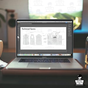 May include: A laptop displaying technical specifications for a vest design. The screen shows detailed diagrams and the text "Technical Specs." The laptop is open on a desk with a leather pad.