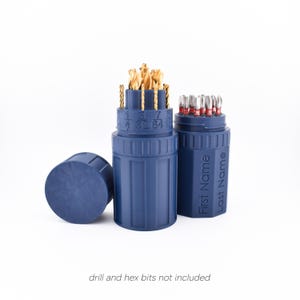 May include: Two blue plastic containers with lids, one with a label that says "First Name Last Name". The containers are filled with drill and hex bits.