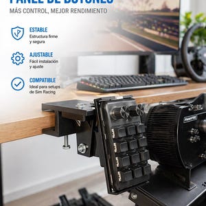 May include: Black button panel for sim racing setups. The panel is mounted on a black metal bracket and attached to a wooden desk. The text on the panel reads "SOPORTE PARA PANEL DE BOTONES". A computer monitor and steering wheel are visible in the background.